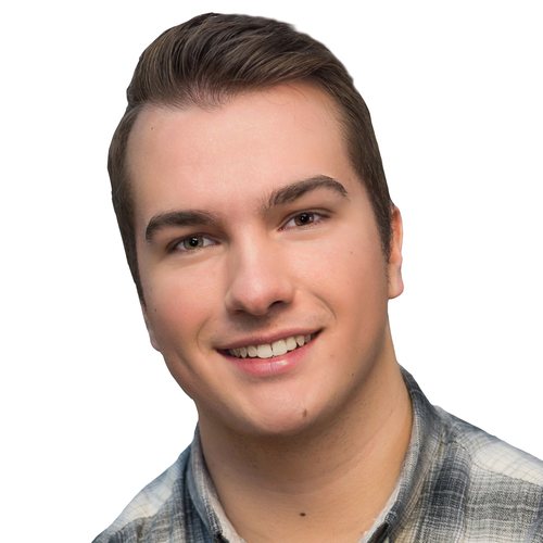 Daniel Reimer, smiling, with short brown hair, in a light flannel shirt